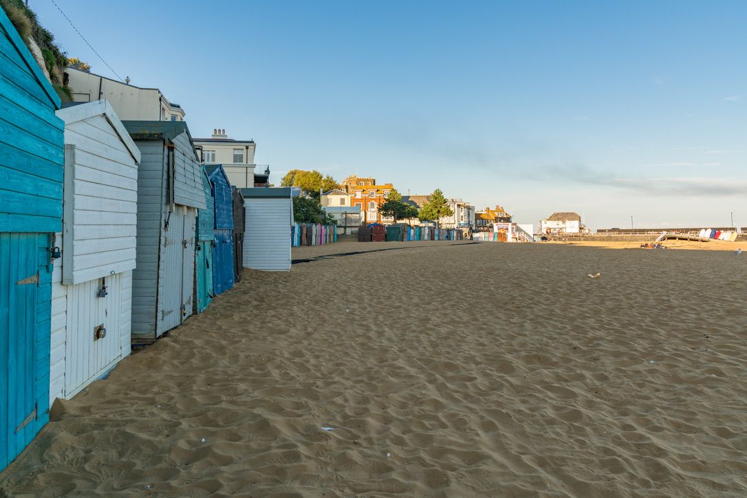 Viking Bay, Broadstairs, Kent, England, UK - September 19, 2017: Beach huts and people on the beach