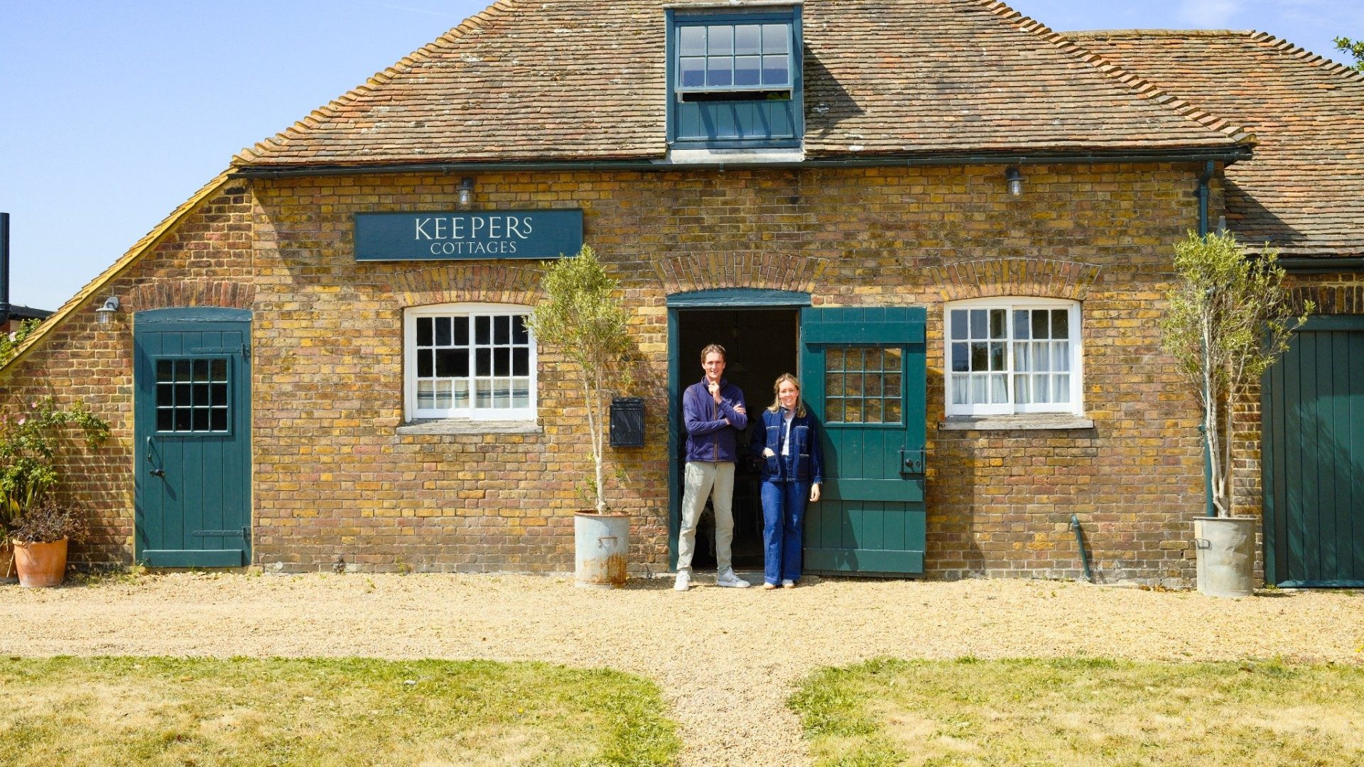 Phoebe and Arthur outside at the Keepers Cottages office.